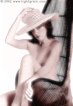 glamour girl in cane chair